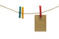 The brown paper is pinned with colorful wooden clip hanging rope.