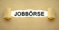 Paper work with the german word for job market - jobbÃÂ¶rse Royalty Free Stock Photo