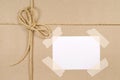 Brown parcel paper background, string, blank address label Royalty Free Stock Photo