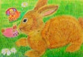 Brown pencil colored easter bunny with the eggs lying on the green grass Royalty Free Stock Photo