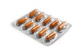 Brown pills in blister isolated on white Royalty Free Stock Photo
