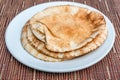 Brown pita bread on a white plate Royalty Free Stock Photo