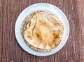 Brown pita bread on a white plate Royalty Free Stock Photo