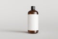 Brown plastic hampoo bottle with label on gray background front view 3D render mockup Royalty Free Stock Photo