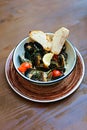 Mussels with cherry tomatoes and lemon lying in brown plate