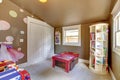 Brown play room kids girl interior with toys. Royalty Free Stock Photo