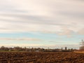 brown ploughed agricultural field outside farm landscape sky ground dirt tree