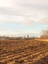 brown ploughed agricultural field outside farm landscape sky ground dirt tree