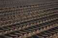 brown plowed land of the agricultural field