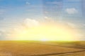 Brown plowed non-seeded field on a background of blue summer sky. sunny sky over an empty meadow. serenity, bliss. desktop Royalty Free Stock Photo