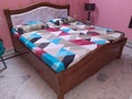 Brown Double Bed with Bedsheets and Pillows