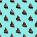 Brown poop on blue background. Seamless pattern.