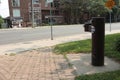 brown public double water drinking fountain with second leveraged out on cement. p