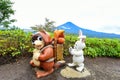 Brown raccoon and white rabbit statue