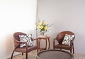 Brown rattan chairs and table