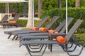 Brown Rattan Chaise Chairs with Orange Towels Royalty Free Stock Photo