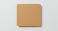 Brown rectangular cork mat with rounded corners on a white background. The surface Royalty Free Stock Photo