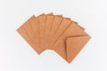 Brown recycle cardboard envelopes on the white background. Craft paper empty envelope template, mock up. Top view Royalty Free Stock Photo