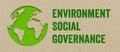 Brown recycled paper backgrpund with green earth and acronym ESG environment social governance