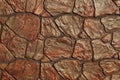 Brown red stone texture of big cobblestones in the wall Royalty Free Stock Photo