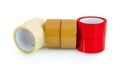 Brown, red and transparent clear adhesive tape isolated on white background with shadow reflection - clipping path.