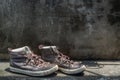 Brown Retro High Top Canvas Sneakers was placed on old cement floor. Vintage age-worn sneakers canvas shoes brown Royalty Free Stock Photo