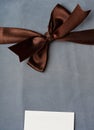 Brown ribbon on jenas background Royalty Free Stock Photo