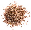 Brown rice heap - whole grain rice with outer hull or husk. Top view