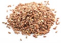 Brown rice heap - whole grain rice with outer husk on white background. Top view