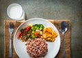 Brown rice with side dish and milk. Royalty Free Stock Photo