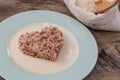 Brown rice on wood background