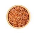 Brown rice in wood bowl on white background. top view Royalty Free Stock Photo