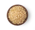 Brown rice in wood bowl on white background. top view Royalty Free Stock Photo