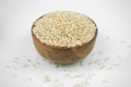 Brown rice in a wooden bowl isolated on white, horizontal studio shot Royalty Free Stock Photo