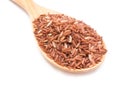 Brown rice with wooden spoon. Royalty Free Stock Photo