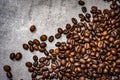 Brown roasted coffee beans closeup grey beton background