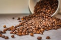 Brown roasted coffee beans closeup grey beton background