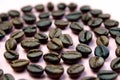 Brown roasted coffee beans folded in a spiral