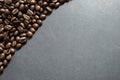 Brown roasted coffee beans, seed on dark background