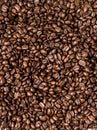 Brown roasted coffee beans, seed on dark background. Espresso dark, aroma, black caffeine drink. Closeup isolated energy mocha, ca Royalty Free Stock Photo
