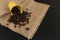 Brown roasted coffee beans in a yellow stainless steel water tank Royalty Free Stock Photo