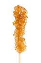 Brown rock candy, sugar candy on a wooden stick, close-up, from above Royalty Free Stock Photo