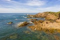 The brown Rocks and Tasman Sea at Birubi Point in regional Australia