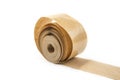 Brown roll of old paper tape for office on the white. Royalty Free Stock Photo