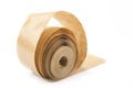 Brown roll of old paper tape for office on the white. Royalty Free Stock Photo