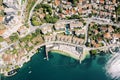 Brown roofs of the Huma Kotor Bay Hotel with a private beach. Dobrota, Montenegro. Drone