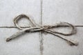 Brown rope bow background on brown paper Royalty Free Stock Photo