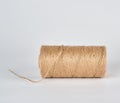 Brown rope of jute, white background