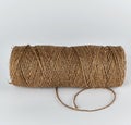 Brown rope of jute, white background