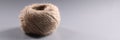 Brown rope roll, skein of jute twine on grey background Royalty Free Stock Photo